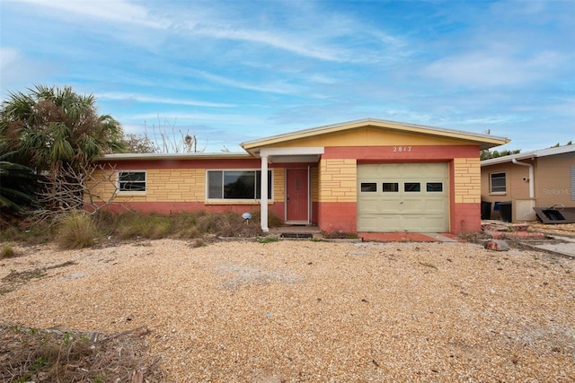 single story home featuring a garage