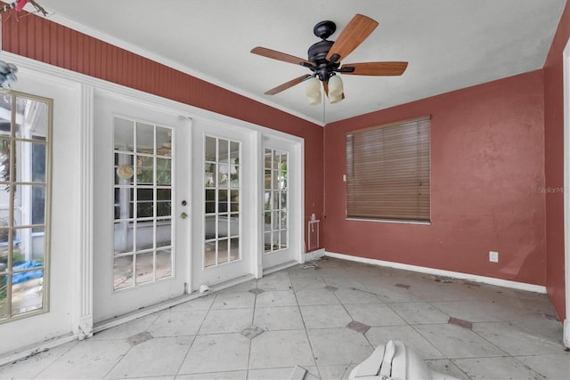 unfurnished sunroom with french doors and ceiling fan