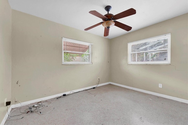 empty room featuring carpet floors and ceiling fan