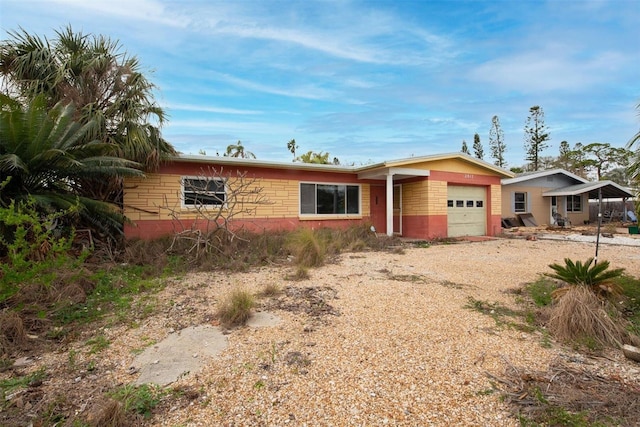 single story home with a garage