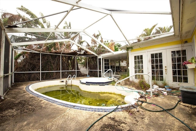 view of pool featuring a patio area, french doors, and glass enclosure