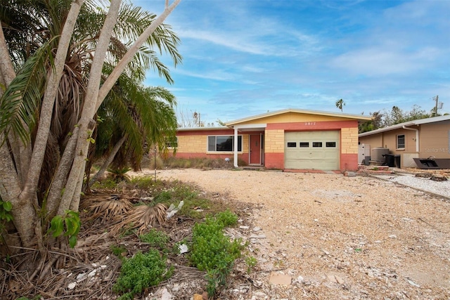 single story home featuring a garage