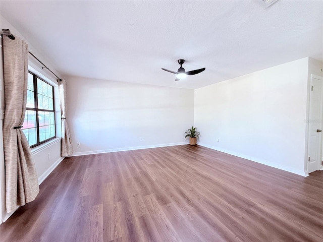 unfurnished room with hardwood / wood-style floors, a textured ceiling, and ceiling fan