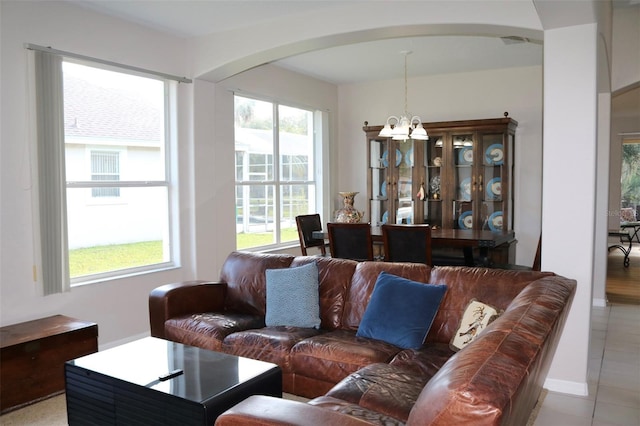 living room with a notable chandelier