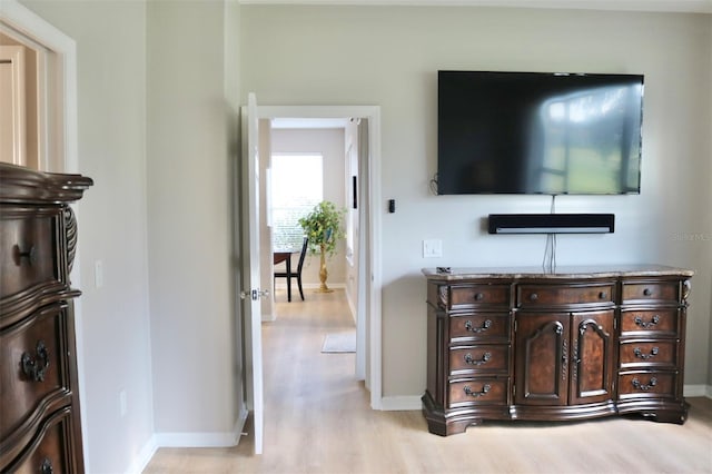 living room featuring light wood-style floors and baseboards