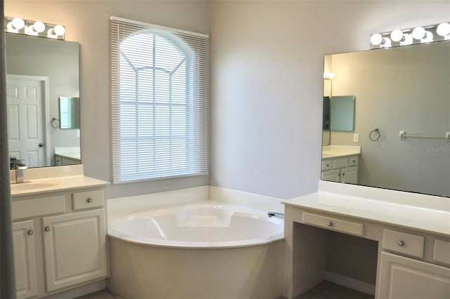 bathroom featuring a tub to relax in and vanity