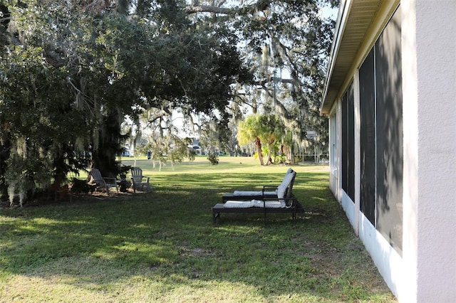 view of yard with a sunroom