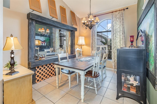 dining room featuring a notable chandelier and tile patterned floors