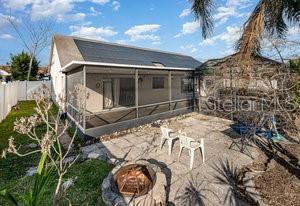 rear view of property featuring a patio