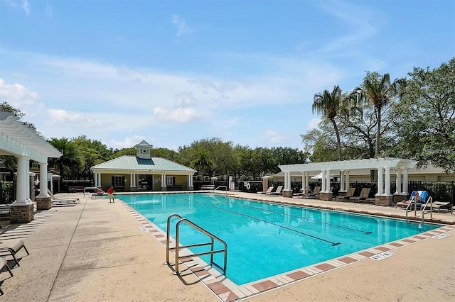 view of swimming pool with a patio and a pergola