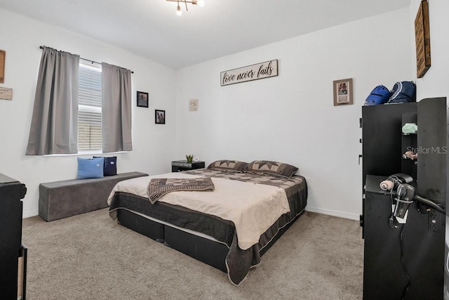 bedroom featuring light colored carpet