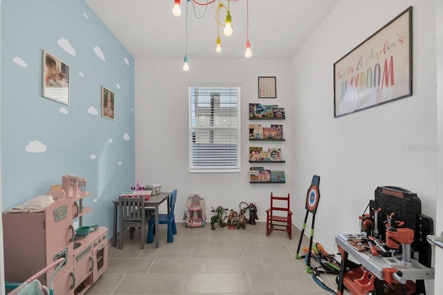 rec room with light tile patterned flooring