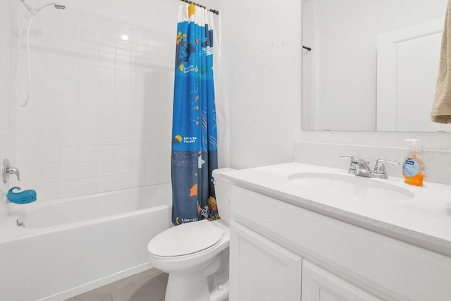 full bathroom featuring shower / tub combo with curtain, vanity, toilet, and tile patterned flooring