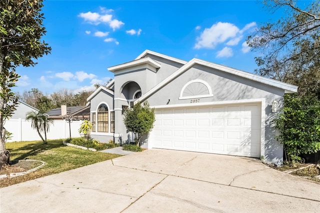 view of front facade featuring a garage and a front lawn