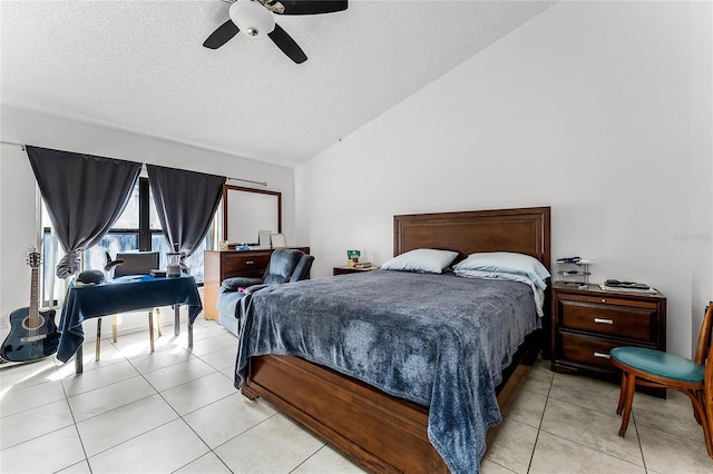 tiled bedroom featuring ceiling fan, lofted ceiling, and a textured ceiling