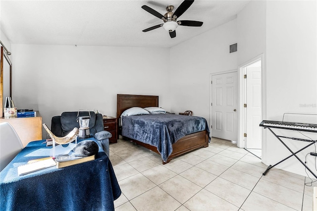 tiled bedroom with vaulted ceiling and ceiling fan