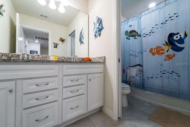 full bathroom with tile patterned floors, vanity, toilet, and shower / bath combo with shower curtain