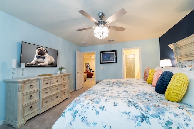 carpeted bedroom with ceiling fan and connected bathroom