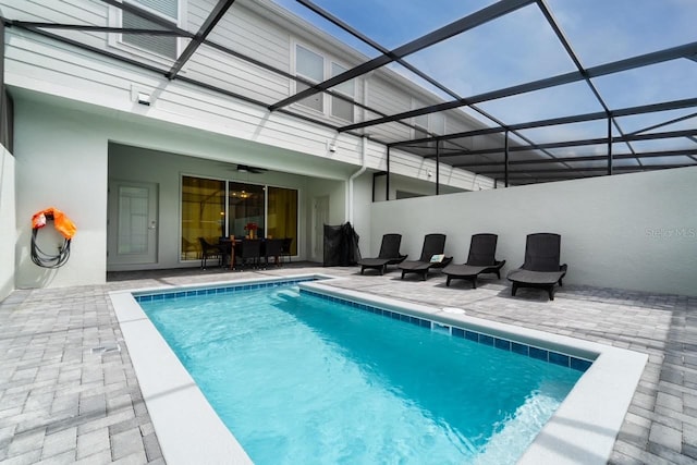 view of pool with a lanai and a patio