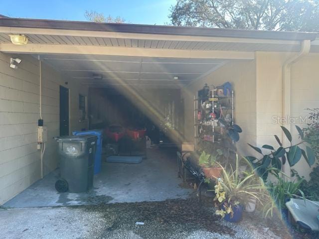 exterior space with a carport