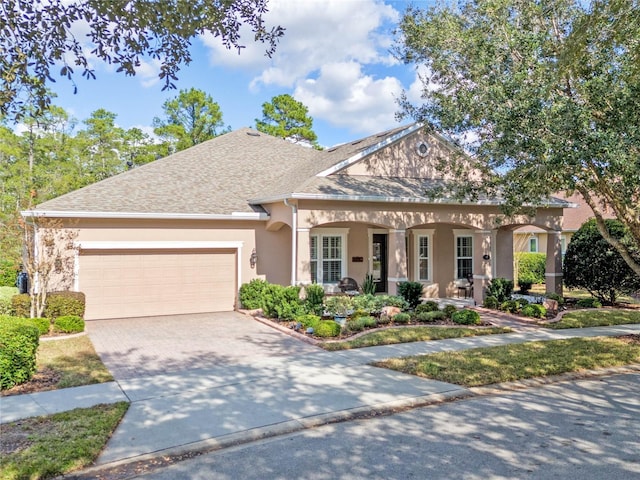 view of front of property with a garage and covered porch