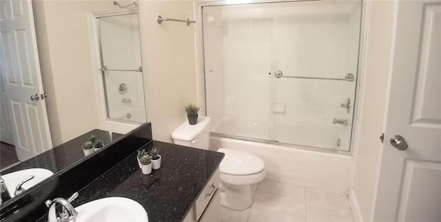 full bathroom with vanity, toilet, tile patterned flooring, and combined bath / shower with glass door