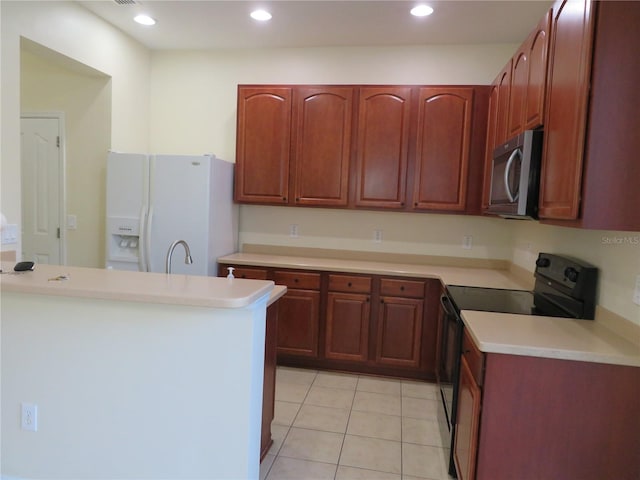 kitchen featuring sink, white fridge with ice dispenser, light tile patterned flooring, black / electric stove, and kitchen peninsula