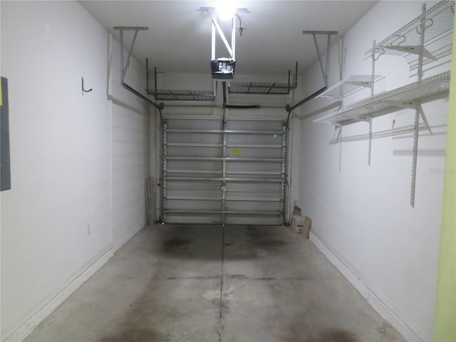 garage featuring a garage door opener and electric panel