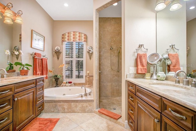 full bathroom with tile patterned flooring, a shower stall, two vanities, and a sink