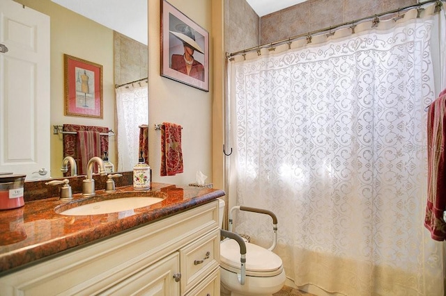 bathroom featuring toilet and vanity