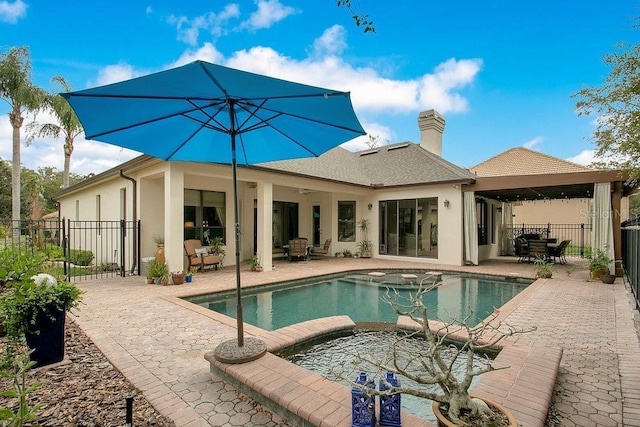 view of pool featuring a patio area, fence, and a fenced in pool