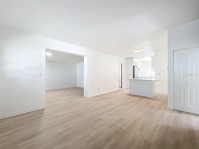 unfurnished living room featuring light wood-type flooring