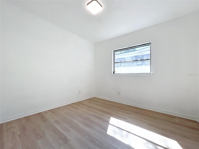 unfurnished room with light hardwood / wood-style flooring