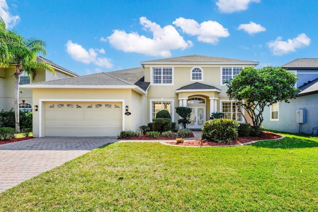 view of front facade featuring a garage and a front lawn