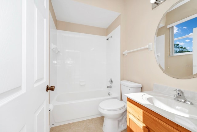 full bathroom featuring vanity, tiled shower / bath, and toilet