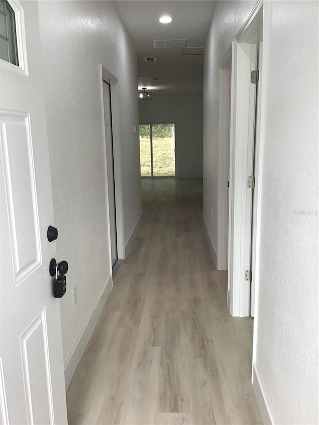 hall featuring light wood-type flooring