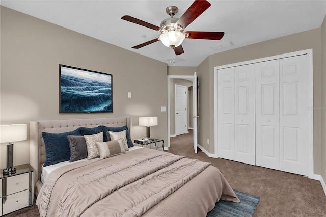 carpeted bedroom featuring ceiling fan and a closet