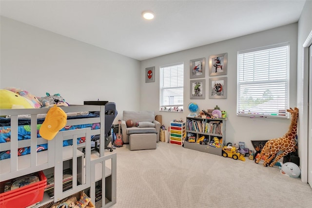 carpeted bedroom with multiple windows