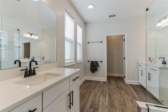 bathroom with vanity and hardwood / wood-style floors