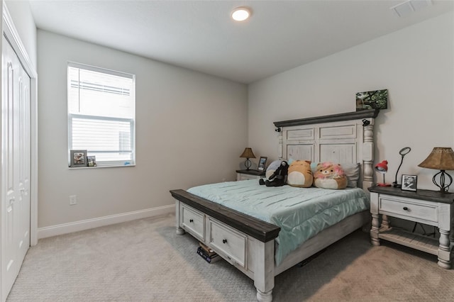 bedroom featuring light carpet