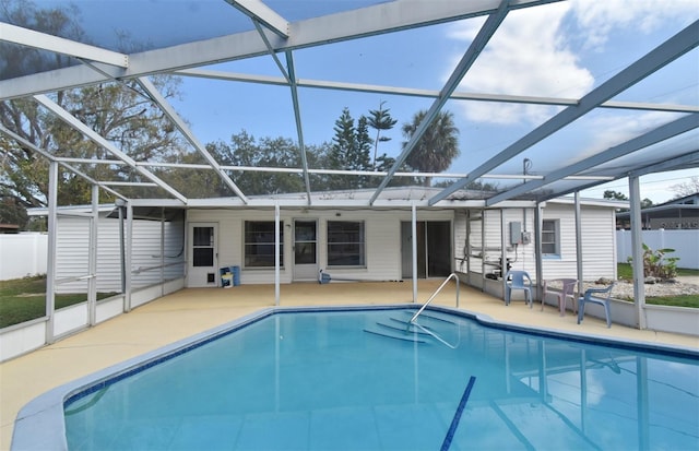 view of pool featuring a patio and glass enclosure