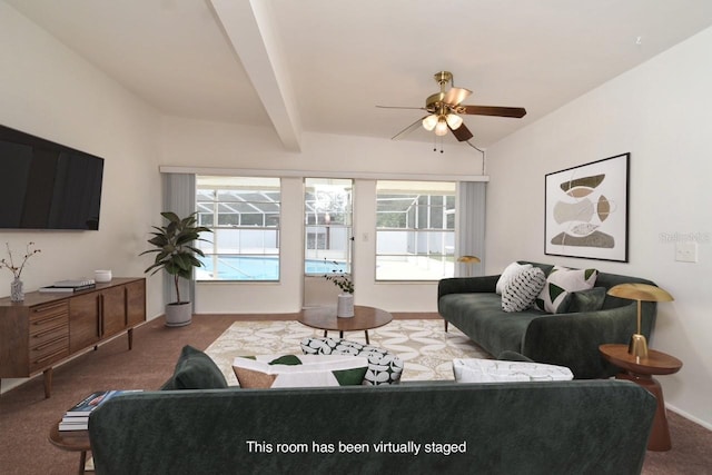 living room with lofted ceiling with beams, carpet, and ceiling fan