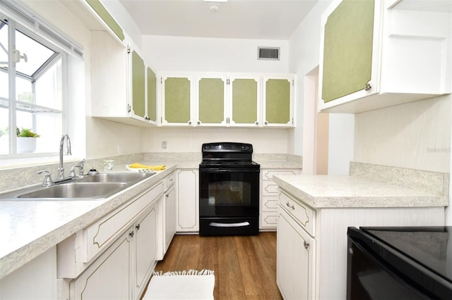 kitchen with white cabinetry, black range with electric stovetop, sink, and dark wood-type flooring