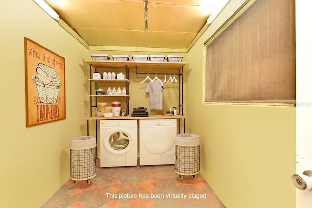 laundry area with washing machine and clothes dryer