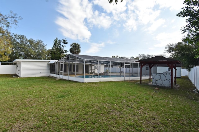 exterior space with a gazebo, a lawn, and a lanai