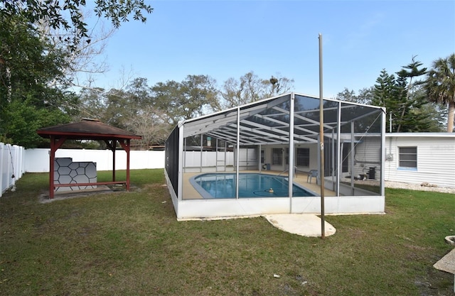 view of pool with a gazebo, a lanai, and a lawn