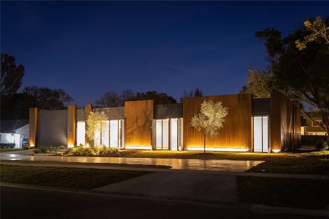 modern home featuring fence