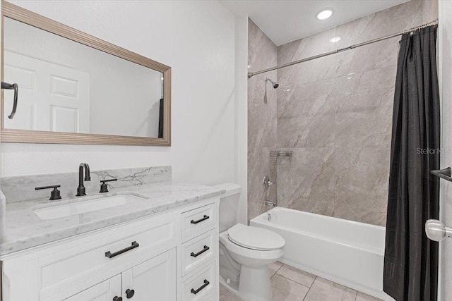 full bathroom featuring tile patterned flooring, vanity, toilet, and shower / bath combo with shower curtain