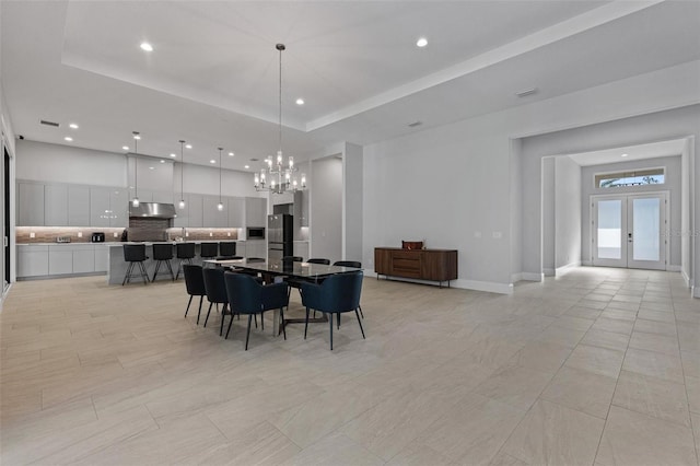 dining area with a notable chandelier, recessed lighting, a raised ceiling, and visible vents