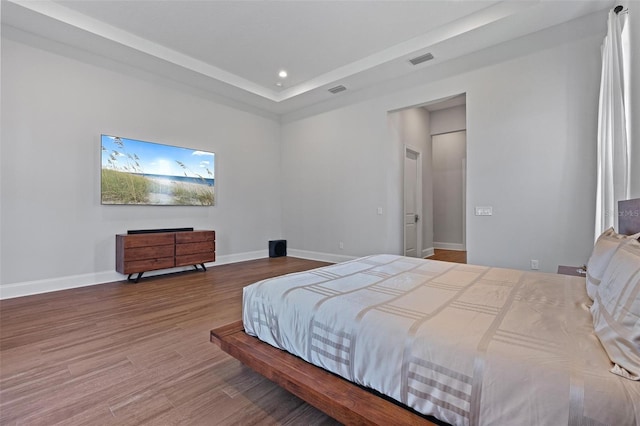 bedroom featuring recessed lighting, visible vents, baseboards, and wood finished floors